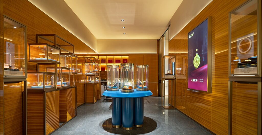 conservation grade display case, international gold jewellery flagship store, blue white design, jewellery showcases, vertical display case, custom jewelry display, customized jewelry showcase