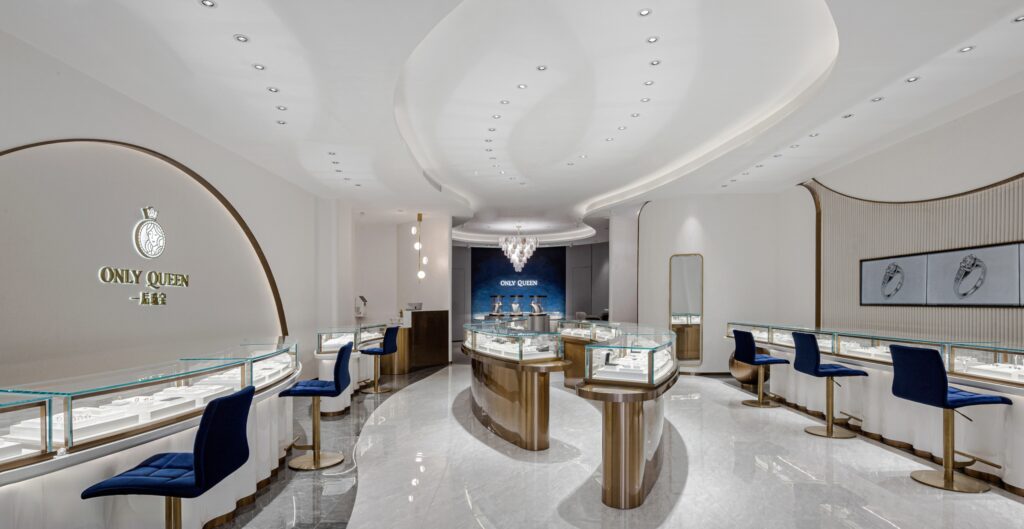 gold counter, core product range, diamond rings, colored gemstones, 18K gold fine jewelry, curved design diamond bracelets, premium glass vitrine for luxury jewelry retail